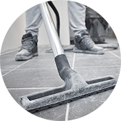 vacuuming dust off floor during post-construction cleaning service in massachusetts